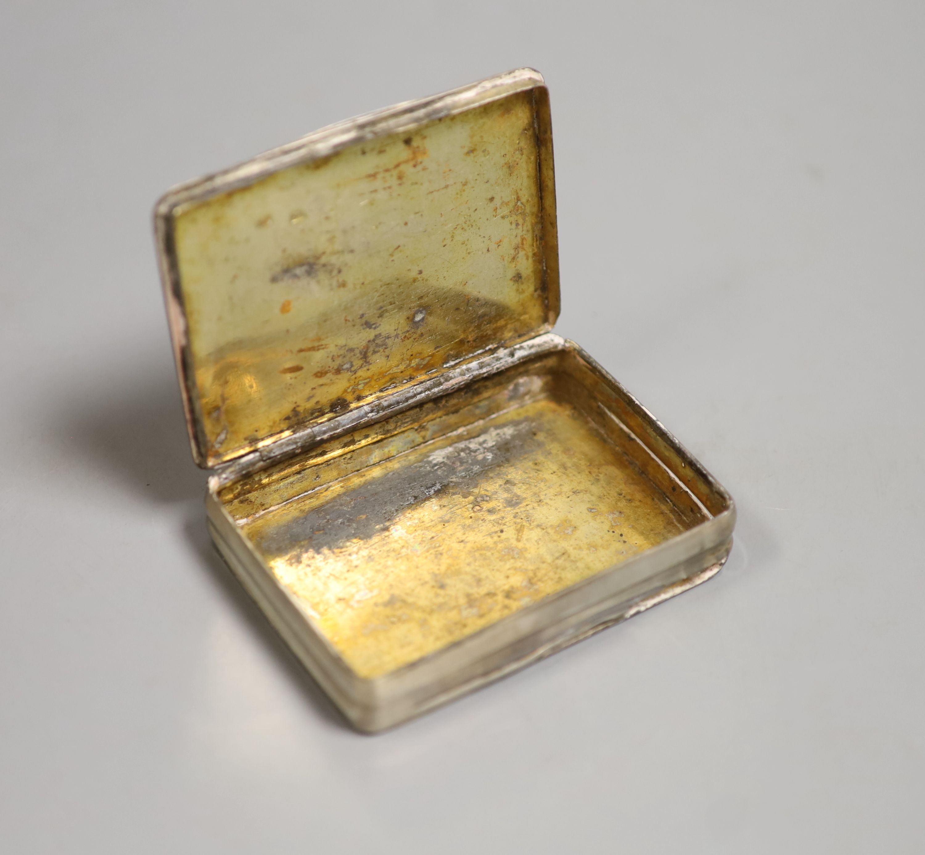 A late 19th/early 20th century Russian silver snuff box, 87mm, 100 grams, (a.f.).